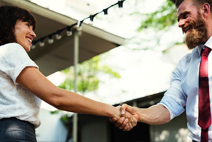 Adults shaking hands - Say Hello