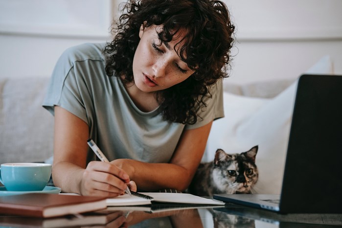 Young woman researching real estate market