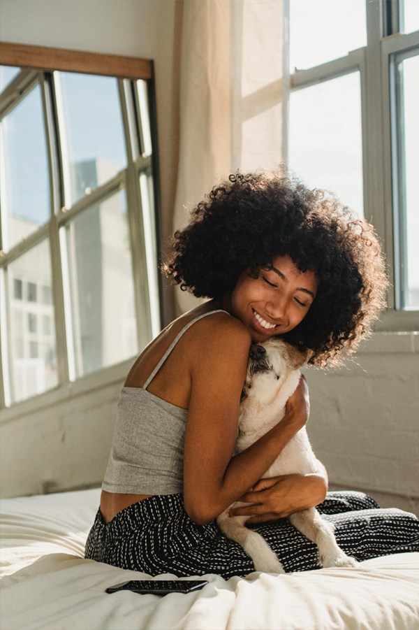 Woman hugging her cat
