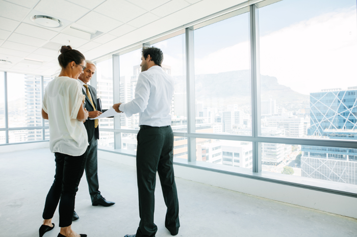 Couple with Realtor in open space